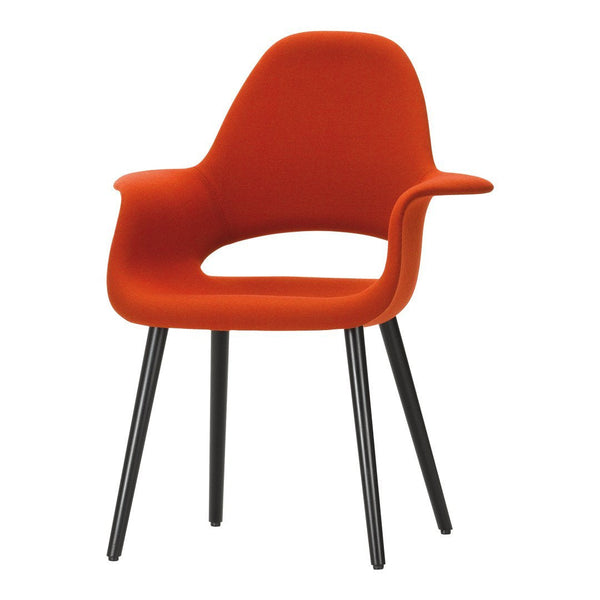 Vibrant orange armchair with a sleek black base, featuring a minimalist design and smooth fabric finish.