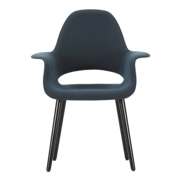 Dark blue chair with smooth, contoured design and contrasting black legs. Perfect for modern interiors.