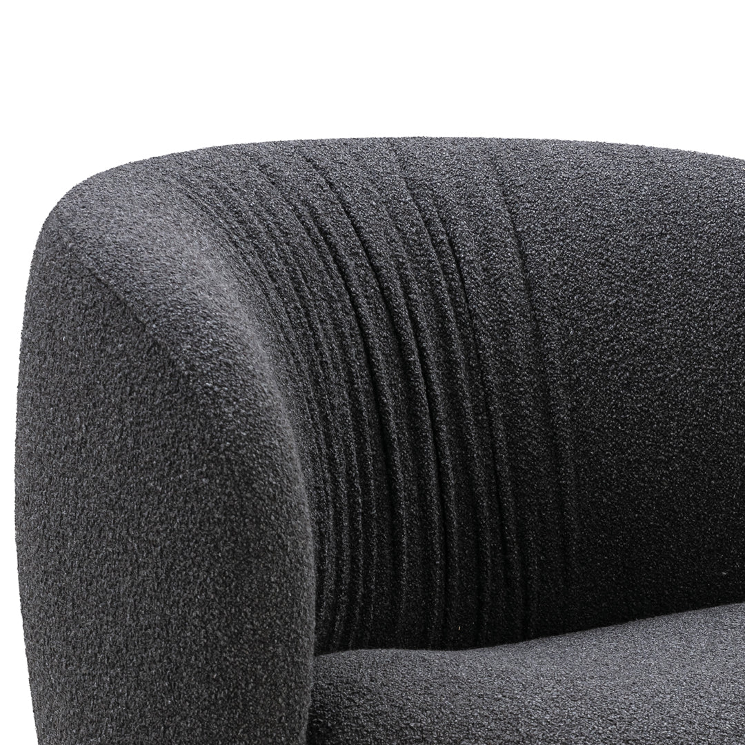 Gray textured upholstery with subtle ribbed pattern. Elegant curved backrest for modern style.