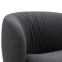 Gray textured upholstery with subtle ribbed pattern. Elegant curved backrest for modern style.