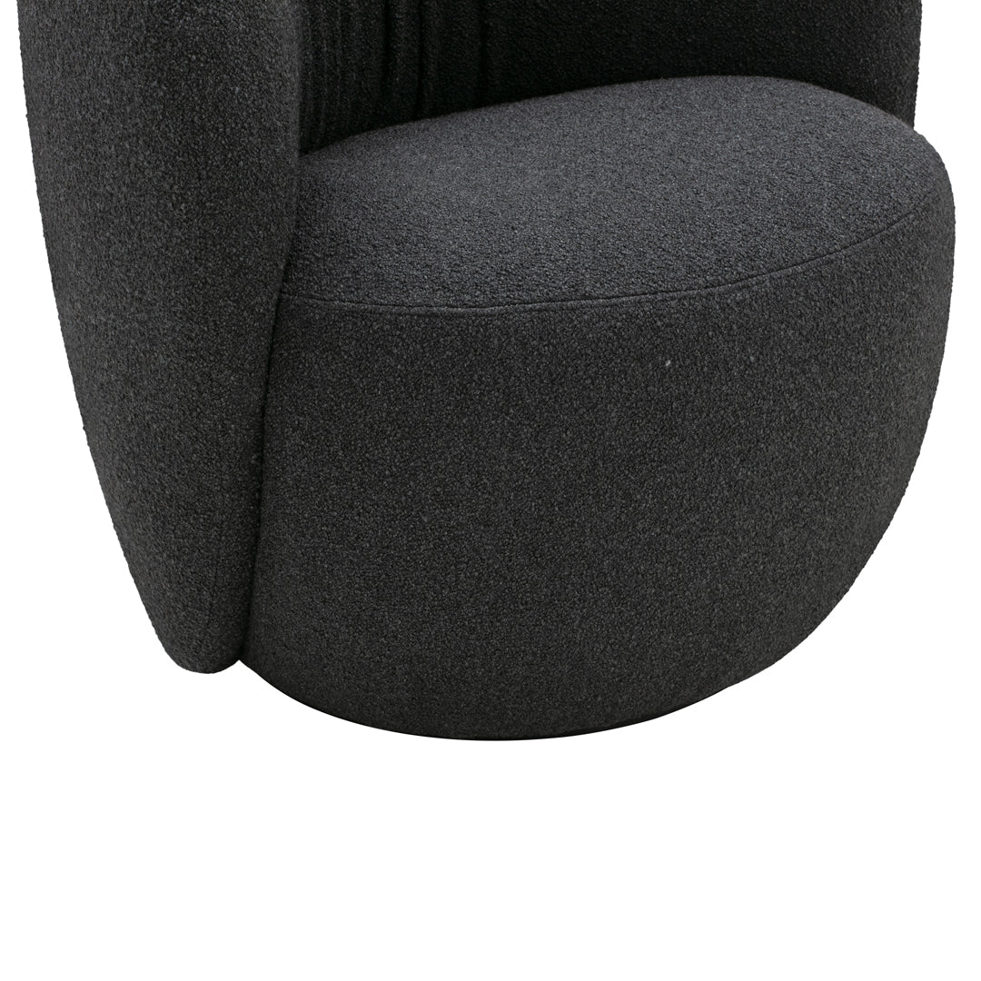 Black textured fabric armchair with a rounded design and plush cushioning for modern decor.