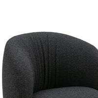 Textured black chair with a soft, upholstered finish and subtle vertical lines, adding modern elegance to any space.