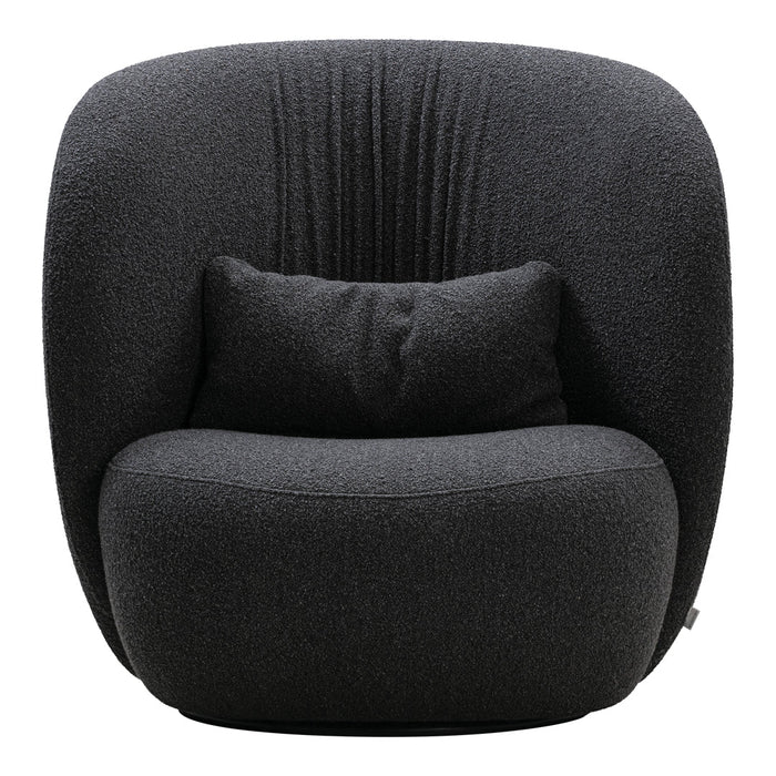 Modern black accent chair with textured fabric and subtle ribbed pattern, featuring a cozy pillow for added comfort.