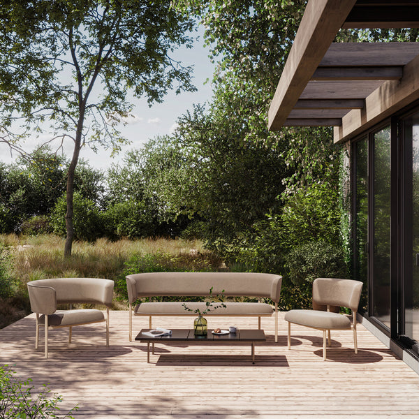 Modern outdoor furniture set featuring neutral beige tones and soft, curved lines, perfect for patio elegance.