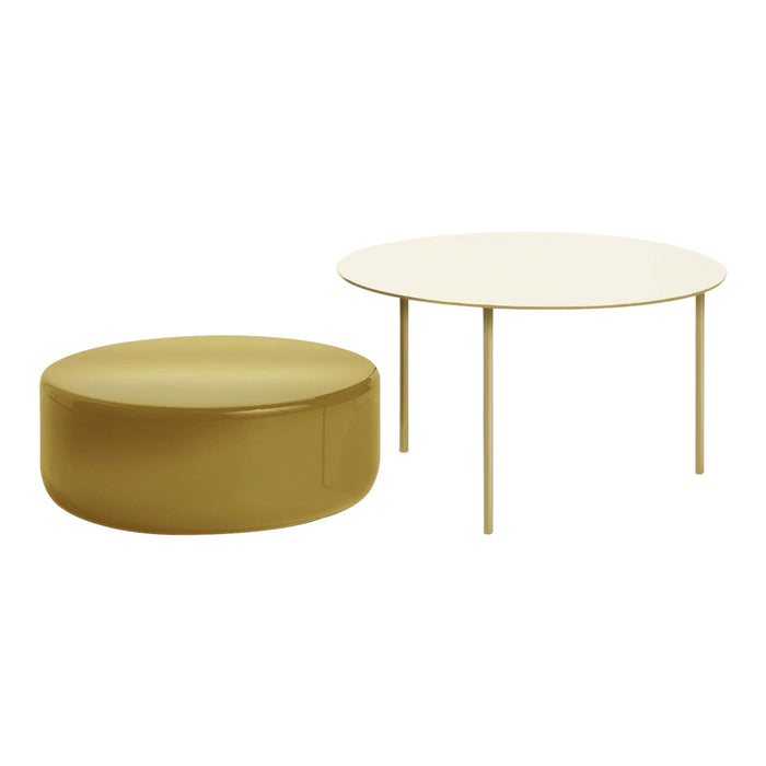 Gold round ottoman and white circular table with slender legs, modern minimalist design. Perfect for stylish interiors.