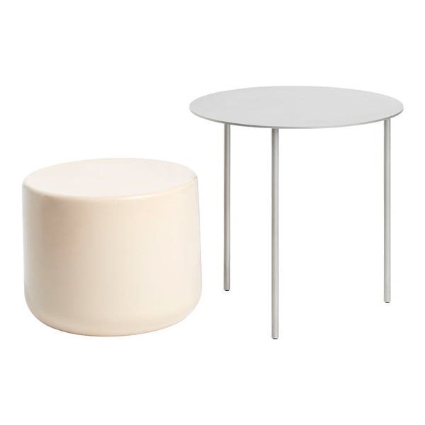 Cream cylindrical stool and light gray round table with sleek metal legs. Modern, minimalistic design.