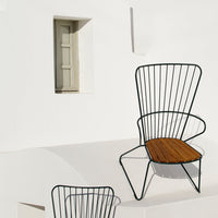 Black wire chair with a natural wood seat, set against a minimalist white background. Stylish and modern design.
