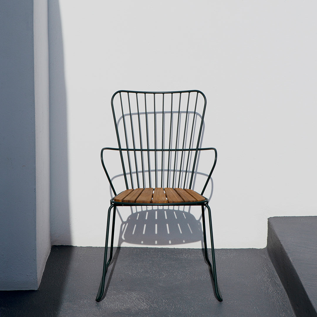 Black metal chair with a wooden seat, featuring a modern, minimalistic design against a white background.