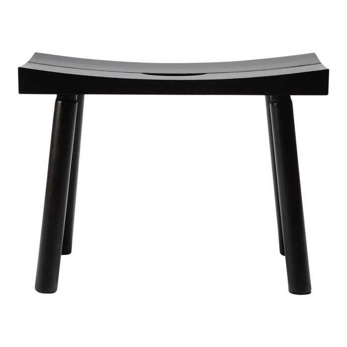 Black wooden stool with a sleek, curved design and clean lines, showcasing minimalist style and modern elegance.