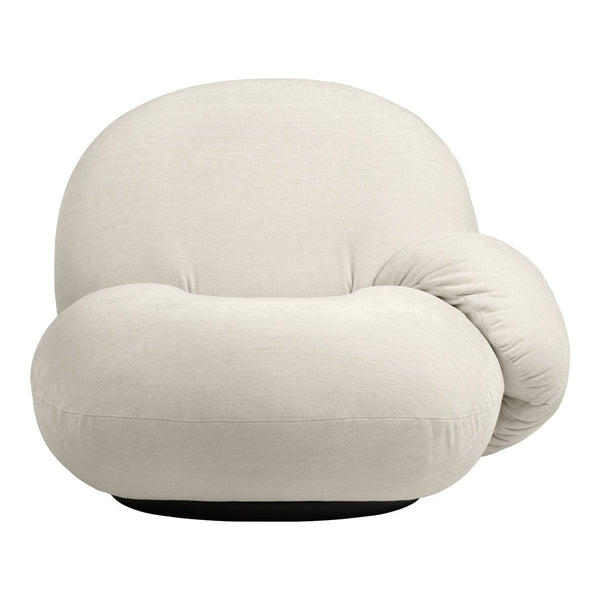 Cream-colored lounge chair with a soft, rounded design and subtle texture, set against a dark base.
