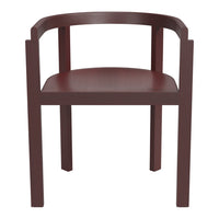 Red wooden chair with a smooth finish and minimalist design, showcasing rich color and clean lines.