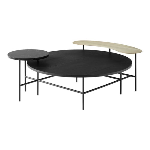 Round and oval coffee tables featuring black and natural wood finishes, with sleek metal legs. Modern minimalist design.