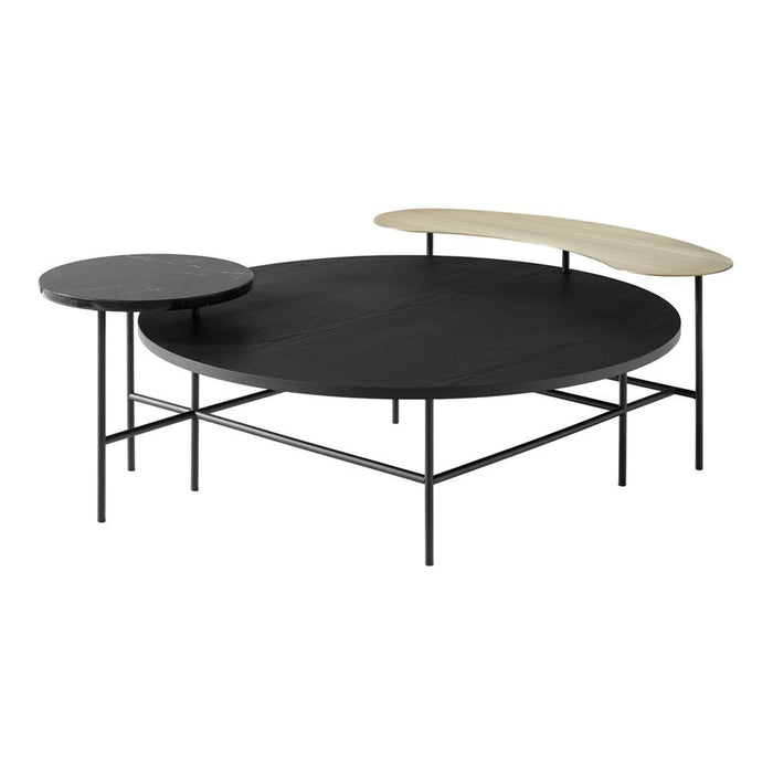 Round and oval coffee tables featuring black and natural wood finishes, with sleek metal legs. Modern minimalist design.