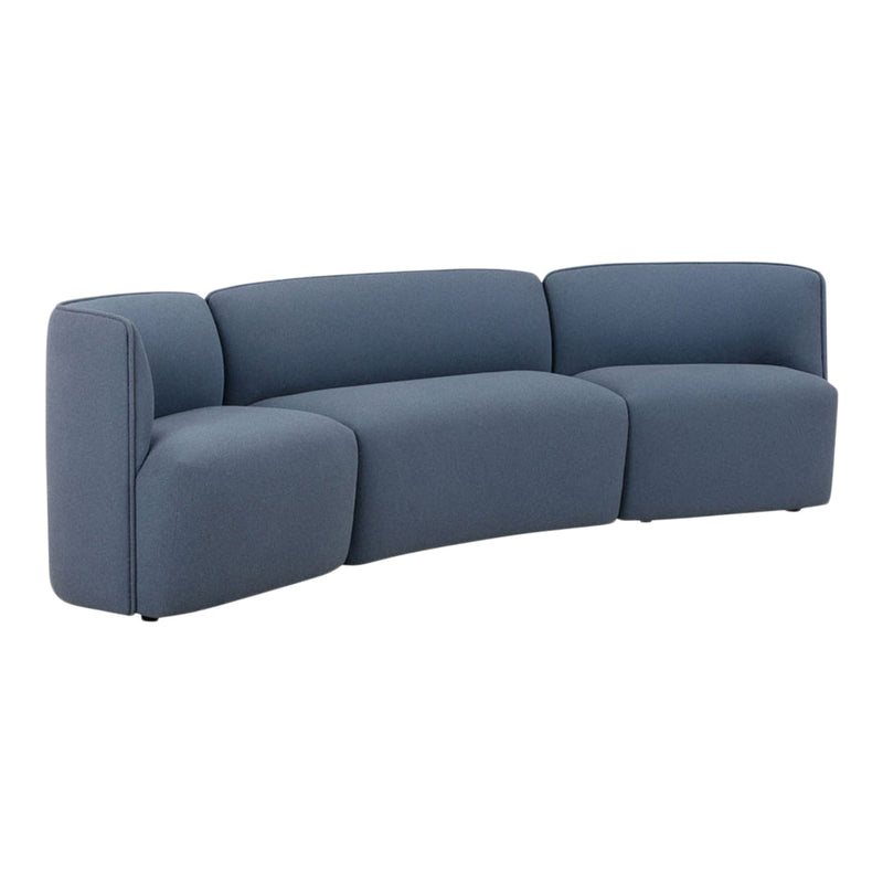Modern curved sectional sofa in a soft, deep blue fabric with a smooth, textured finish. Perfect for contemporary decor.