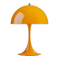 Orange Panthella table lamp on a white background