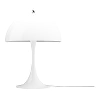 White table lamp with a cylindrical base and round shade on a white background