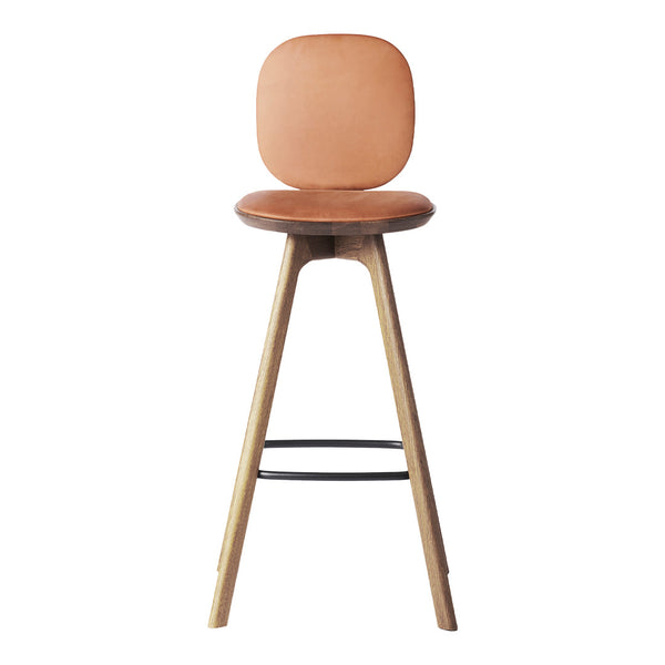 Light brown leather bar stool with a smooth round seat and natural wood legs, featuring a minimalist design.