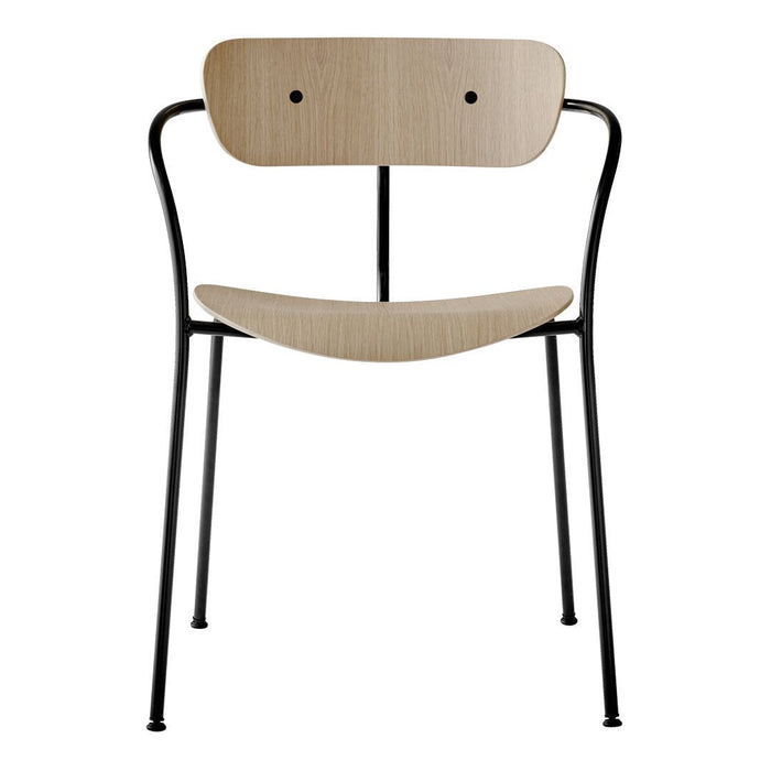 Natural wood and black metal chair featuring a minimalist design with smooth, curved lines and two round backrest holes.