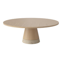 Round wooden table with a smooth light oak finish and a contrasting beige stone base. Minimalist design, no patterns.