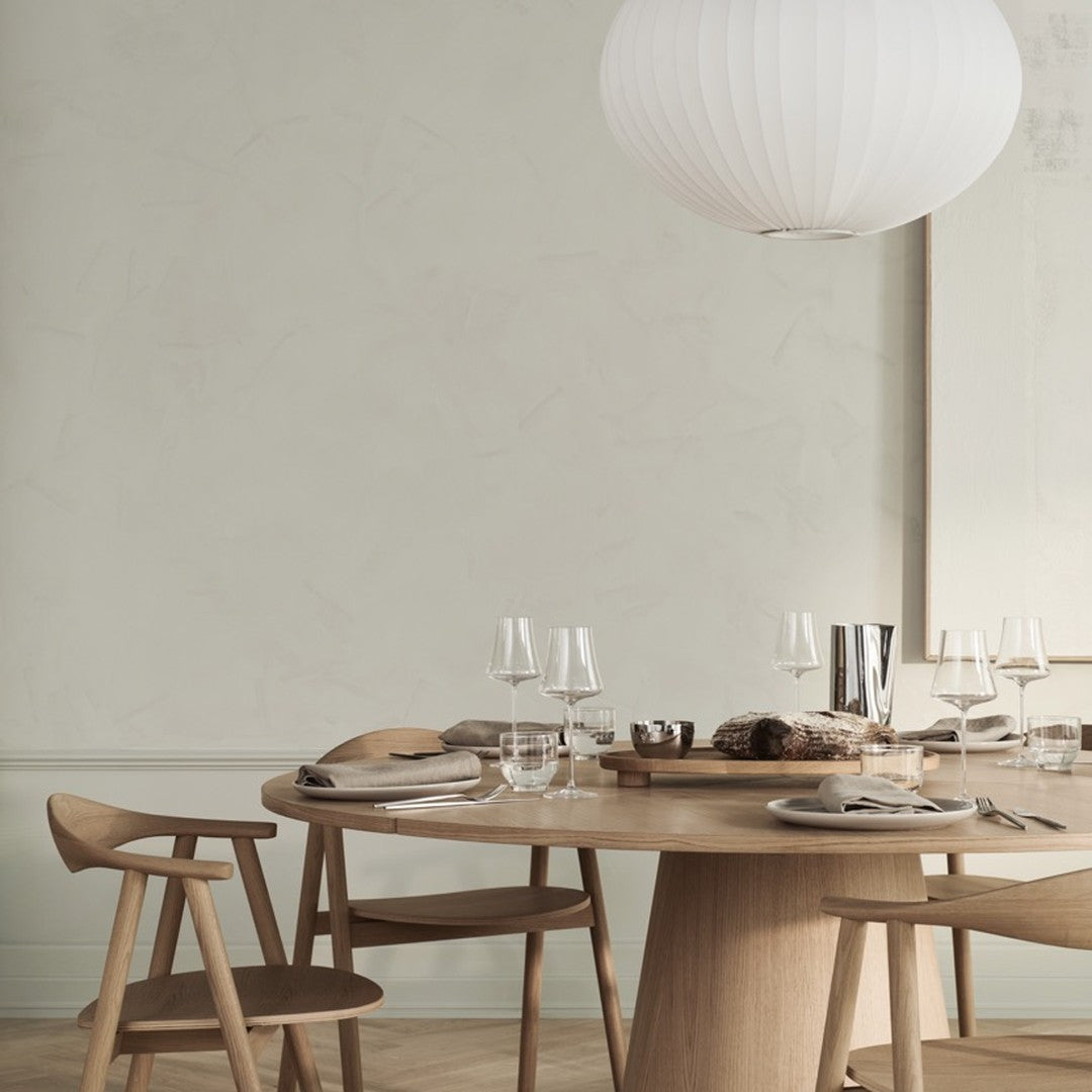 "Neutral tones with light wood and subtle textures, featuring minimalist decor and elegant table settings."