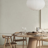 "Neutral tones with light wood and subtle textures, featuring minimalist decor and elegant table settings."
