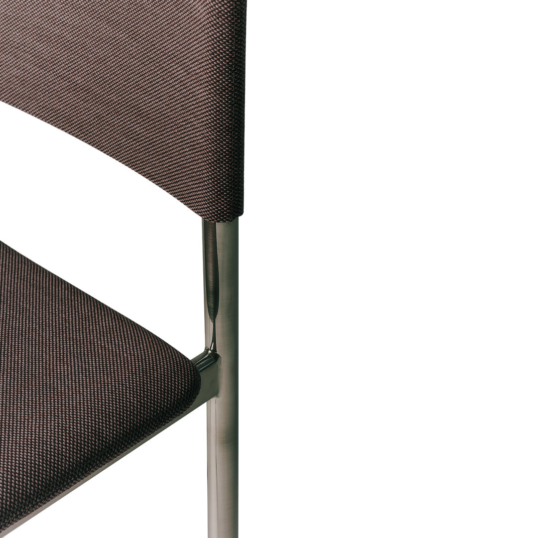 Brown textured upholstery with a sleek chrome frame, combining modern elegance and comfort.