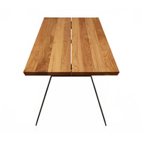 Natural wood dining table with a sleek, light oak finish and minimalist black metal legs, featuring a seamless grain pattern.