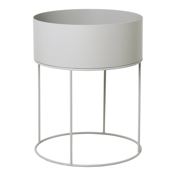 Gray cylindrical planter with a minimalist metal frame, featuring a smooth, matte finish for a modern touch.