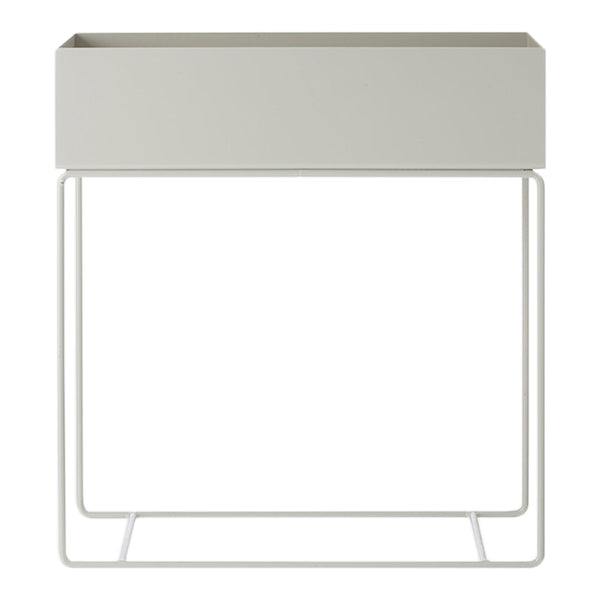 Gray planter with a sleek, minimalist design, featuring a matte surface and sturdy white metal frame.