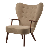 Beige upholstered armchair with tufted back and wooden legs, featuring a stylish mid-century modern design.