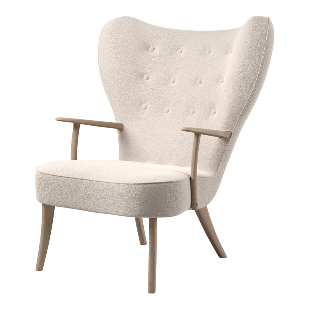 Elegant cream fabric armchair with a tufted back and light wooden legs, featuring a soft, minimalist design.