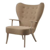 Stylish beige armchair with tufted fabric and natural wood legs, featuring a modern design and elegant silhouette.