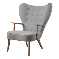 Light gray upholstered chair with tufted buttons and natural wood arms, featuring a modern wingback design.