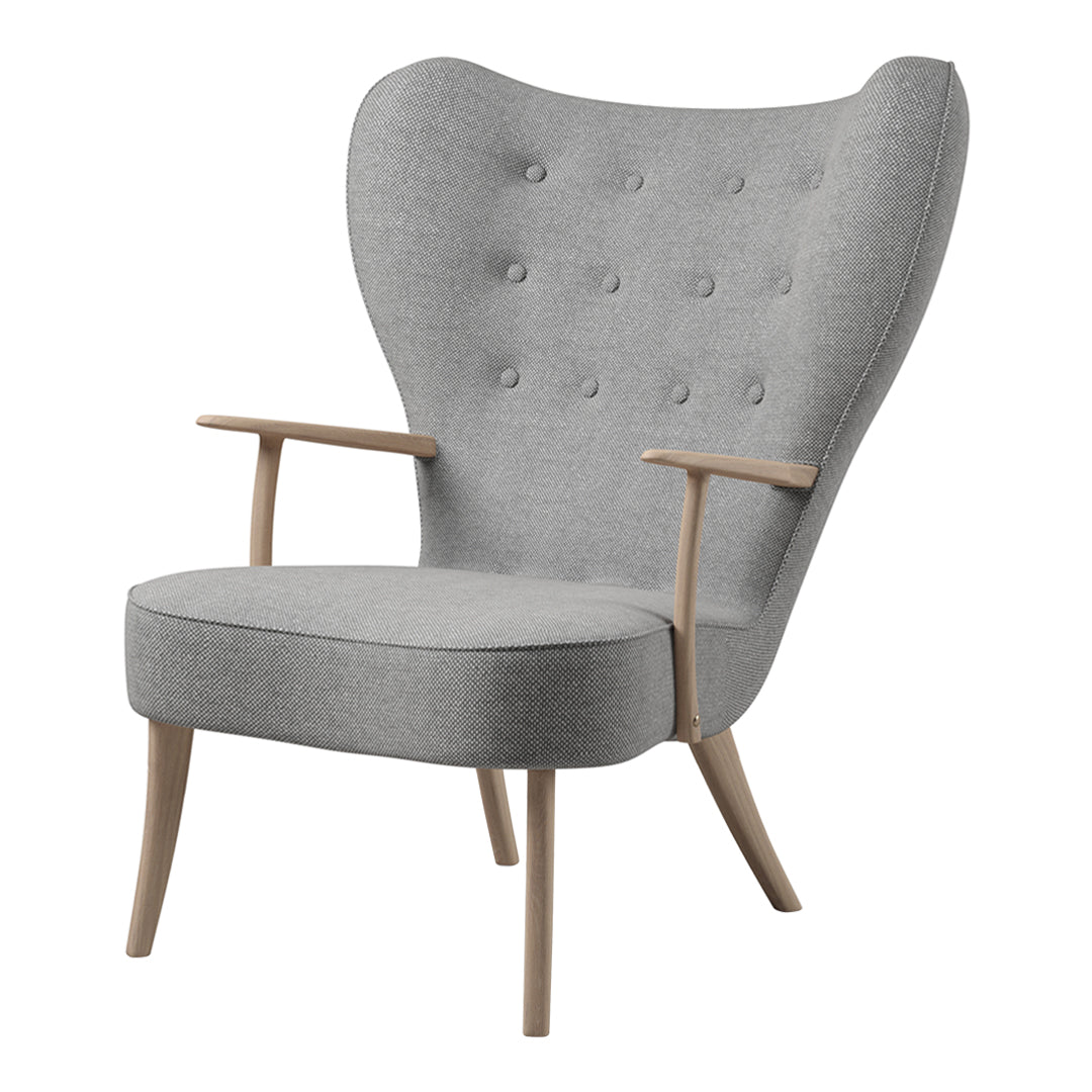 Modern gray wingback chair with button tufting and light wood legs, perfect for contemporary decor.