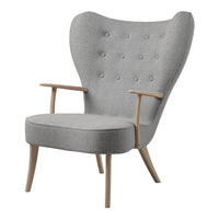 Modern gray wingback chair with button tufting and light wood legs, perfect for contemporary decor.