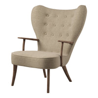Beige upholstered chair with tufted design and wooden legs, featuring a modern, minimalist shape.