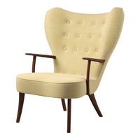 Yellow upholstered chair with button-tufted design and wooden arms, featuring a mid-century modern style.