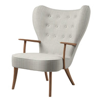Light gray tufted fabric armchair with subtle vertical stripes and natural wood legs. Perfect for modern decor.