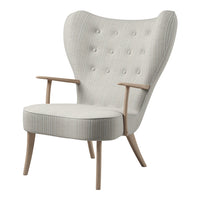 Light gray upholstered armchair with subtle vertical stripes and button-tufted backrest, featuring natural wood legs.