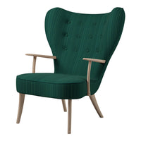 Green striped armchair with button tufting and wooden legs, showcasing a sleek, modern design.