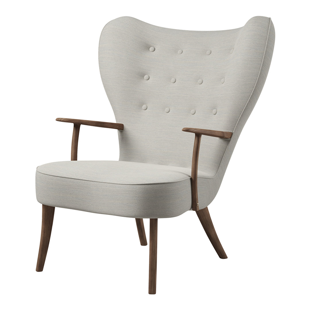 Light gray upholstered chair with tufted design and natural wood legs, featuring an elegant mid-century modern style.