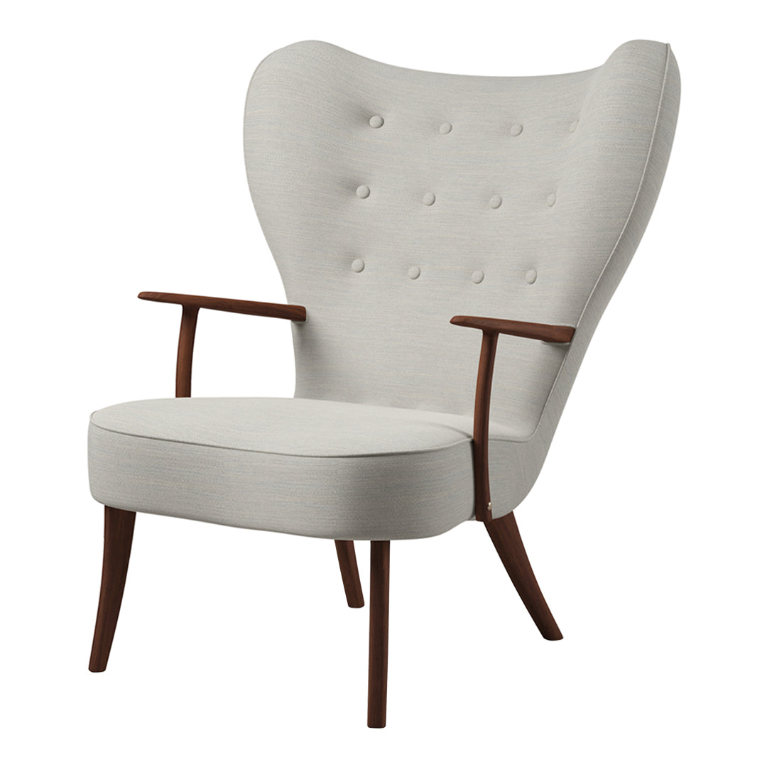 Light gray upholstered armchair with button tufting and wooden legs for a modern vintage touch.