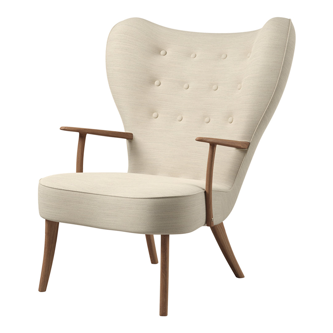 Cream upholstered chair with button detailing and natural wood arms, featuring a distinctive wingback design.