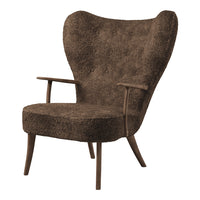 Brown textured armchair with a plush fabric finish and wooden legs, featuring a unique wingback design.