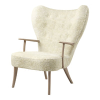 Cream-colored armchair with a textured, fluffy upholstery and wooden legs, featuring a stylish, classic silhouette.