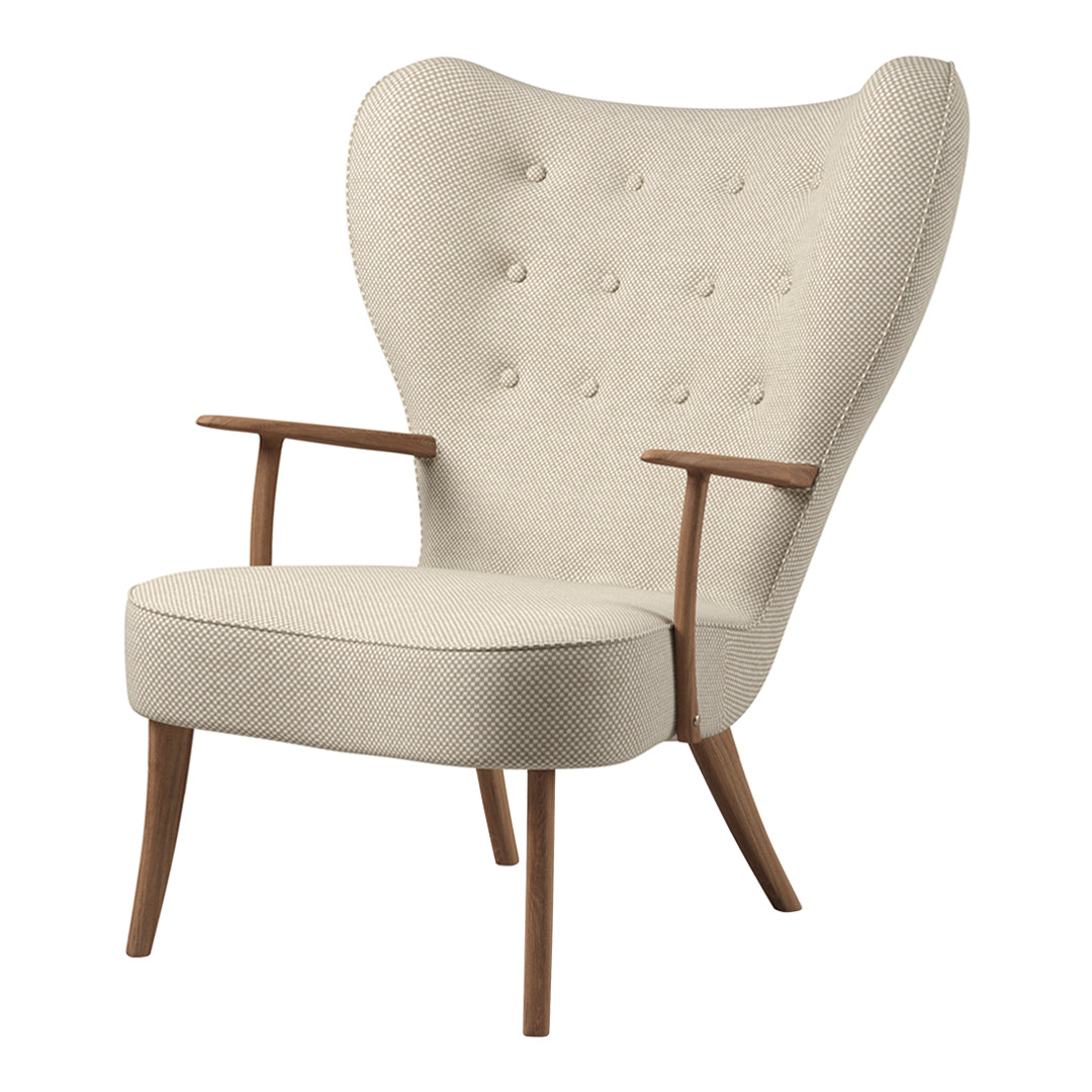 Beige upholstered chair with button tufting and wooden legs, featuring a unique wingback design.