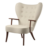 Cream upholstered armchair with tufted buttons and wooden legs, featuring a sleek, modern design.