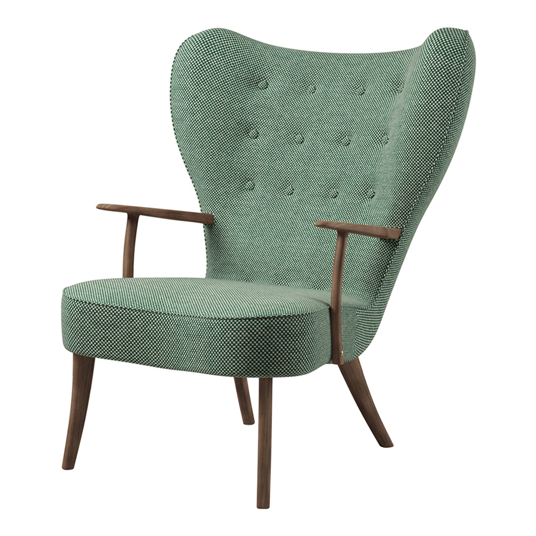 Vintage-style armchair in soft mint green fabric with a textured pattern and wooden legs.