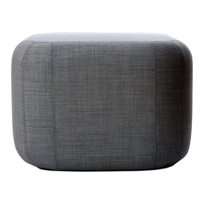 Gray upholstered ottoman with a subtle textured pattern, featuring rounded edges and a contemporary design.