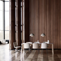 Modern dining room featuring warm wood tones, neutral chairs, and geometric flooring patterns. Elegant and minimalist design.